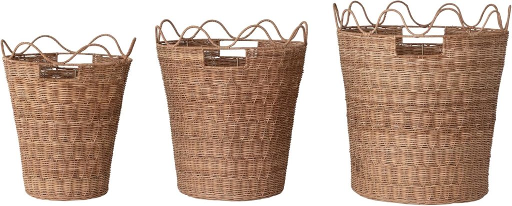 Three brown wicker baskets of varying sizes are arranged in a row, each featuring a wavy, open top and small rectangular handles—perfectly complementing rattan furniture with their natural, textured charm.