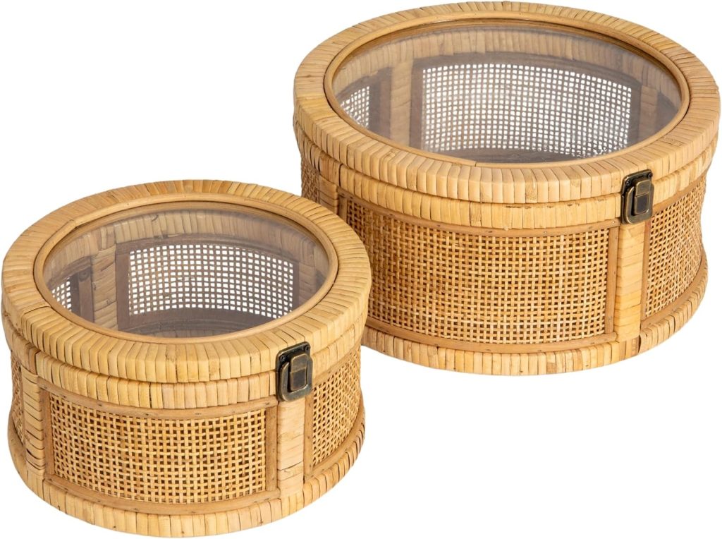 Two round wicker baskets with glass lids and metal clasps, one smaller and one larger, placed side by side on a white background—perfect accents to complement your rattan furniture.