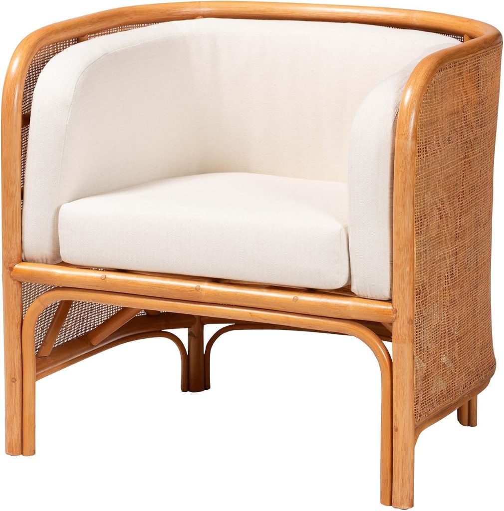 A light wood frame armchair with curved sides, cane panels reminiscent of classic rattan furniture, and white upholstered seat and back cushions.