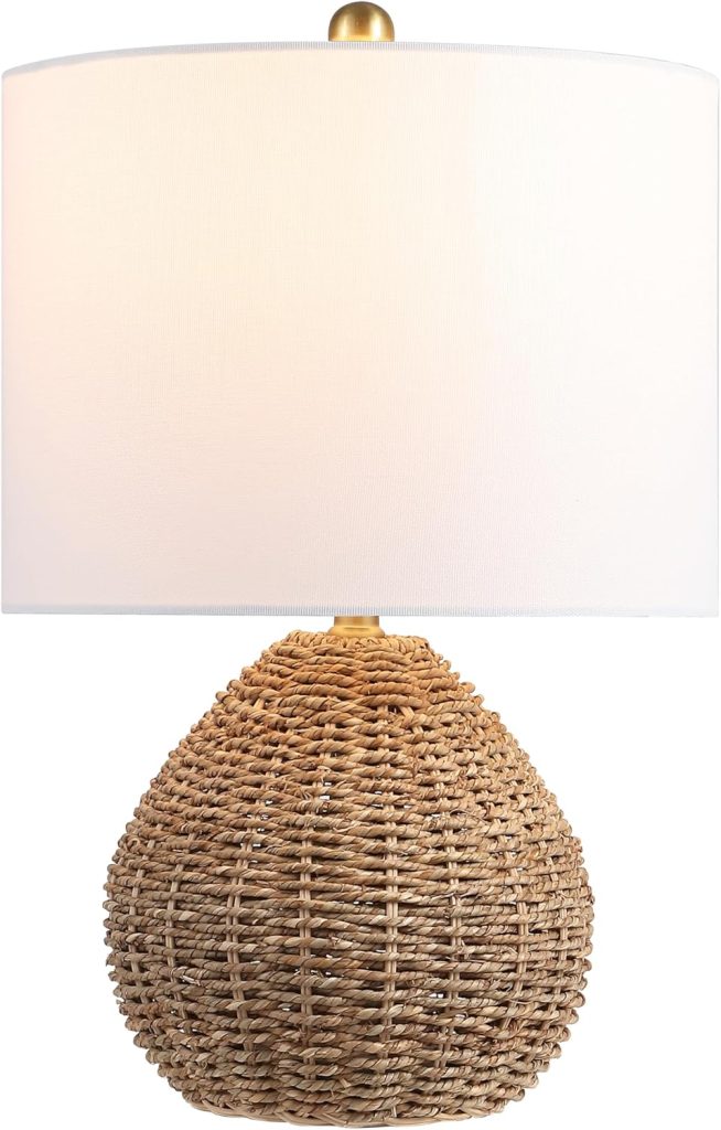 Table lamp with a round woven rattan base reminiscent of classic rattan furniture, and a large white cylindrical fabric lampshade, pictured against a plain white background.