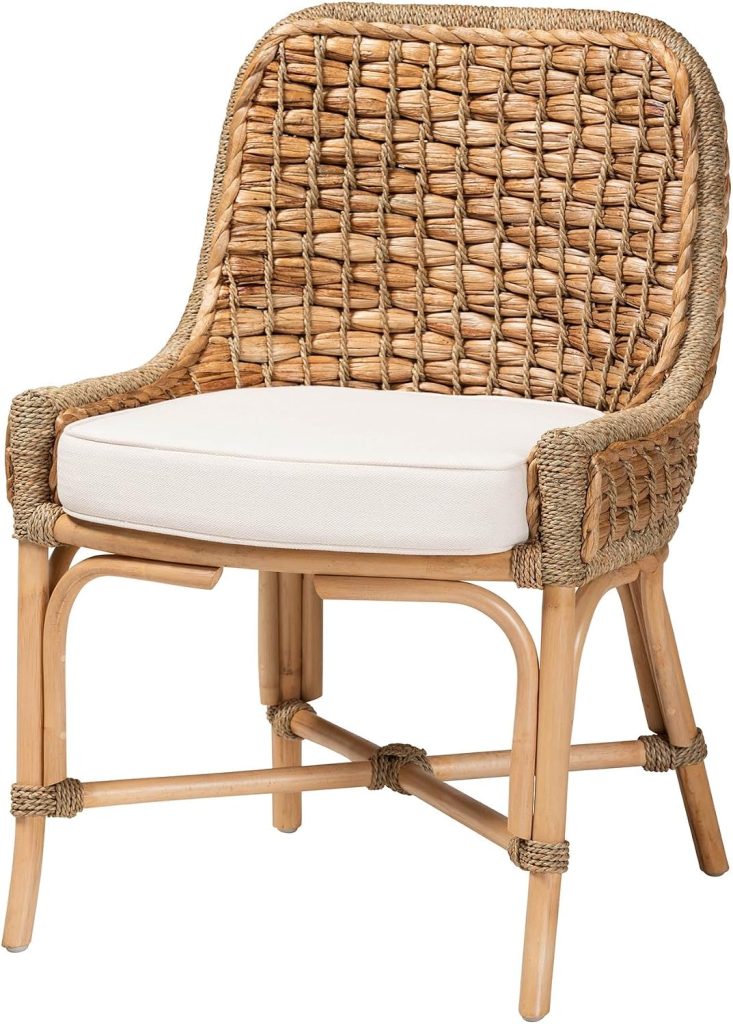 Woven rattan chair with a curved backrest, wooden legs, and a white cushioned seat—an elegant addition to any space that highlights the timeless appeal of rattan furniture.