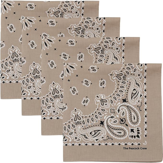 Four beige bandanas with a white and black paisley pattern, arranged overlapping each other, with "The Peacock Crew" printed on one corner.