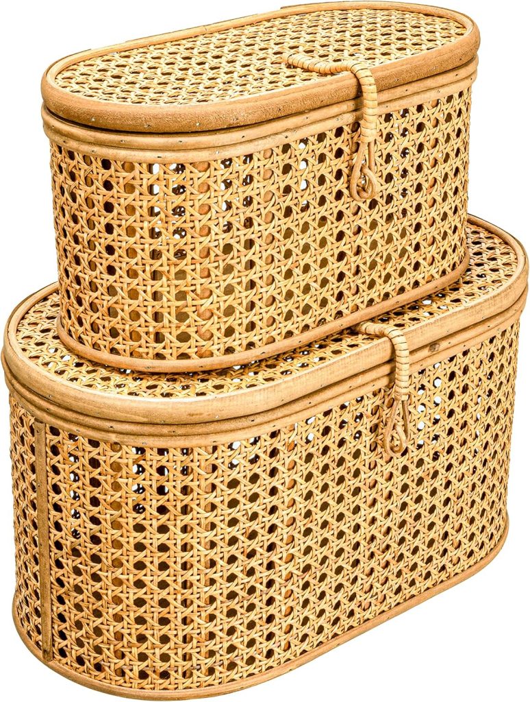 Two rectangular woven rattan baskets with lids, one stacked on top of the other, each featuring a rope loop closure—a stylish storage addition that beautifully complements your rattan furniture.