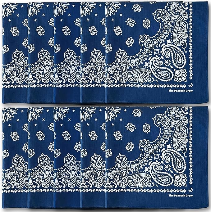 Two rows of folded navy blue bandanas with white paisley patterns, stacked side by side, featuring “The Peacock Crew” printed in one corner.