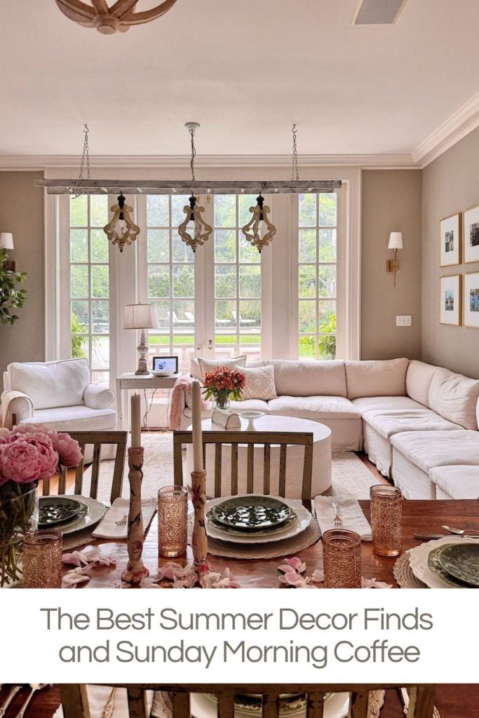 Bright living room with large windows, a white sectional sofa, fresh flowers, and a dining table set with pink glassware. Text reads: “The Best Summer Decor Finds and Sunday Morning Coffee.”.